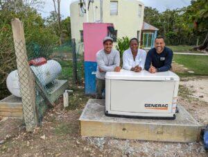 lights inc team standing with a generator installed at liberty children's home in belize